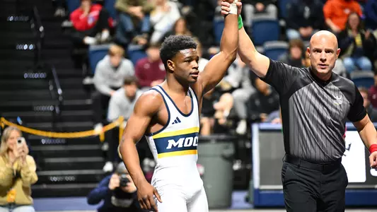 Isaiah Powe earns the hand raise after his third-place win in the 2024 Southern Scuffle.
