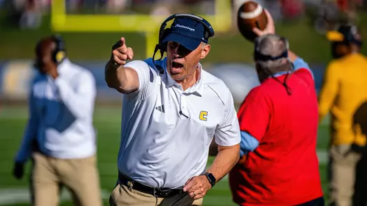 Coach Rusty Wright celebrates a big first down for his offense.