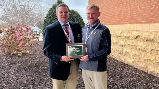 Chip Ward receives award for Collegiate Field of the Year for his work with golf's Player Development Complex.