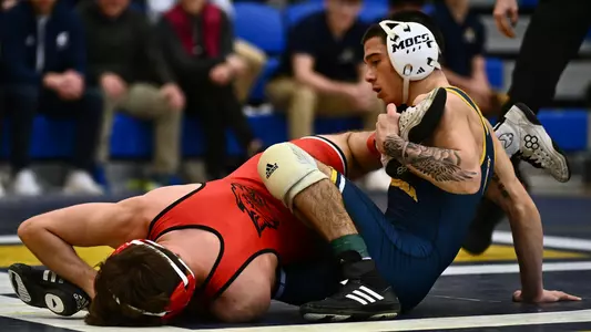 Chaz McDonald works on the mat against Davidson in a win by fall.