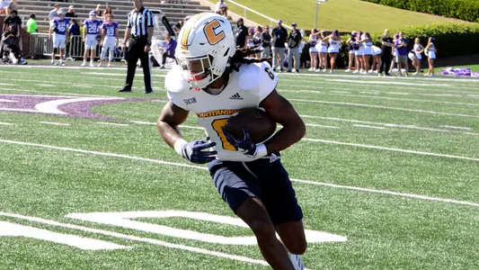 Javin Whatley looks upfield as runs after one of his 10 catches at Furman