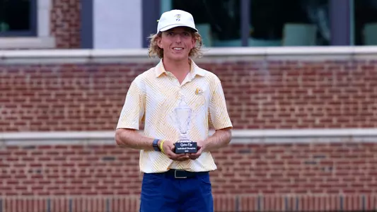 Camden Braidech poses with the trophy in his first win at the Qubein Cup