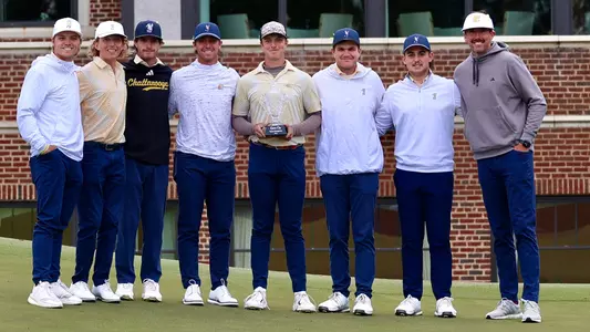 The Mocs pose with the Qubein Cup trophy in their first win of 2024-25