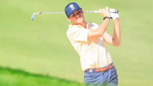 Carson Johnson follows his iron effort from a hilly lie at Kentucky