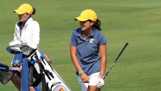 Violeta Fernandez-Tagle flashes a grin while using body English leaning left at Vandy