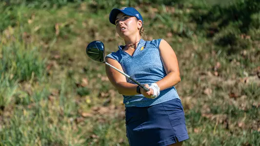 Giulia Foresta poses with driver pointed in front of her following her drive intently at Vandy