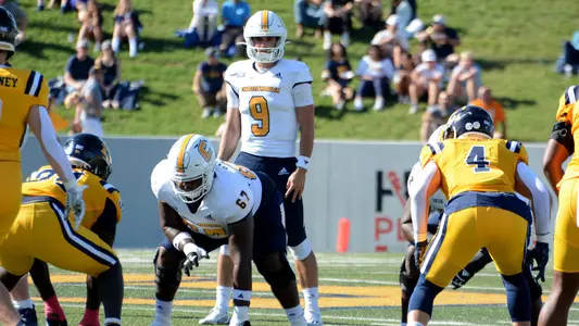 Chase Artopoeus surveys the defense pre-snap at ETSU