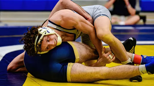 Dayne Dalrymple works on the mat for bonus points in 2023 win over Queens