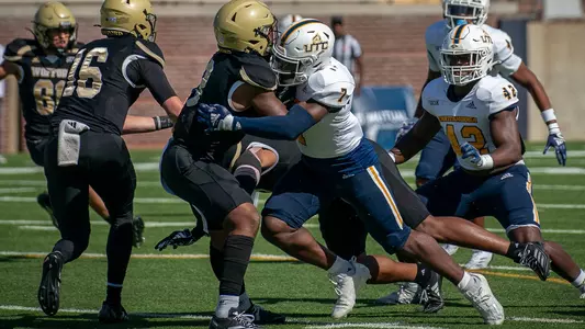 Reuben Lowery III makes a crushing tackle in the win over Wofford