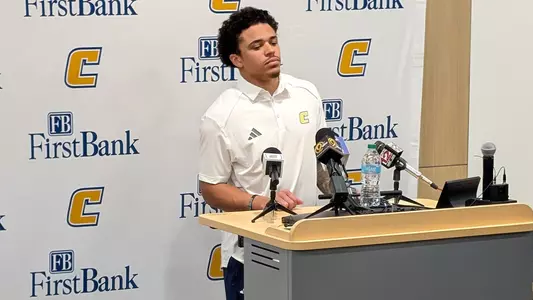 Sam Phillips listens to a question at the Mocs weekly Tuesday press conference