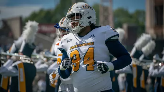 Marlon Taylor runs on the field prior to the Wofford win