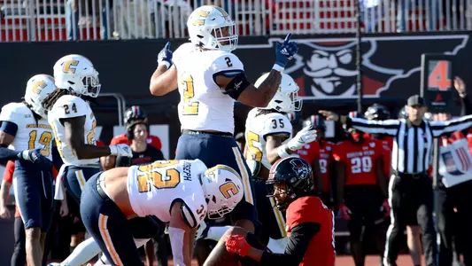 Alex Mitchell celebrates a big stop at Austin Peay