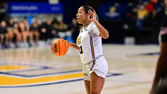 Caia Elisaldez calls a play from the frontcourt with an OK sign