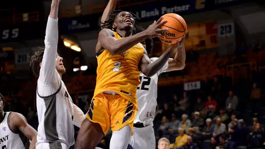 Trey Bonham floats by defenders for a layup against Bryant
