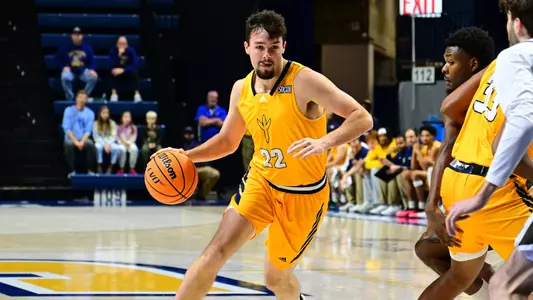 Bash Wieland dribbles into the paint looking to create against Bryant