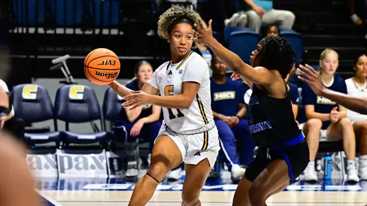 Caia Elisaldez looks to fire the ball to the wing off her baseline drive