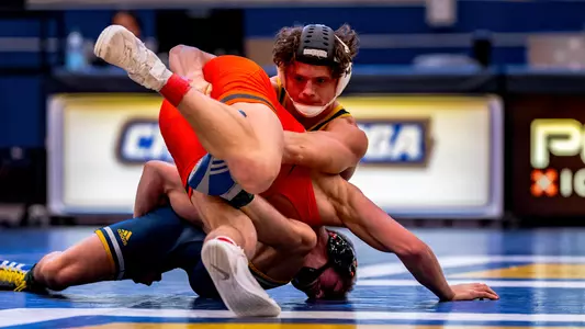 Dayne Dalrymple looks for the advantage on the mat against Purdue