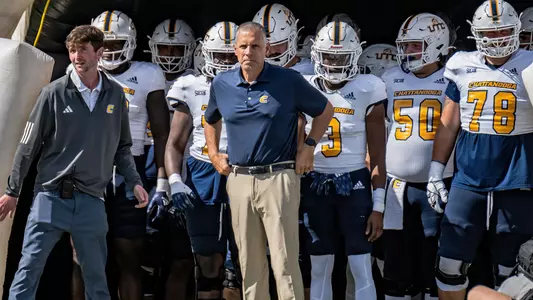 Coach Rusty Wright and the Chattanooga Mocs prepare to run onto Finley Stadium before the win over Wofford