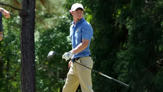 John Houk stares down his drive during second round of Southern Conference Championships
