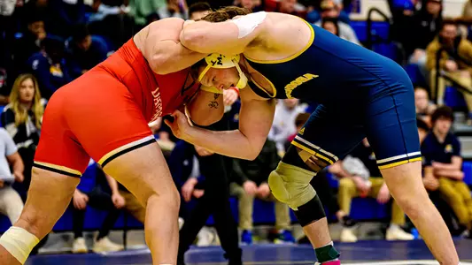 Kaleb Snodgrass works for position in a tie on his feet against Davidson.