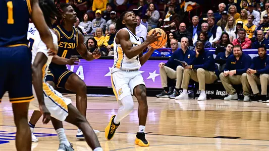 Trey Bonham drives to the basket in a double-double SoCon Semis performance vs ETSU