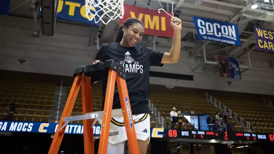 Jada Guinn holds up her piece of net following the 2024 SoCon Championship win