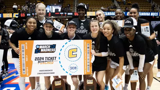 The 2024 SoCon Champions pose with trophies and the NCAA Ticket Punched sign following win over UNCG