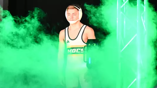 Brayden Palmer is enveloped in green smoke as he makes his championship match entrance at SoCon Tournament