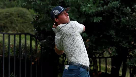 Dalton Chuba holds his pose watching his approach to the green.