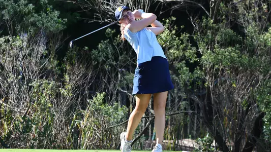 Makenzie Cooper follows her tee shot at Old Dominion