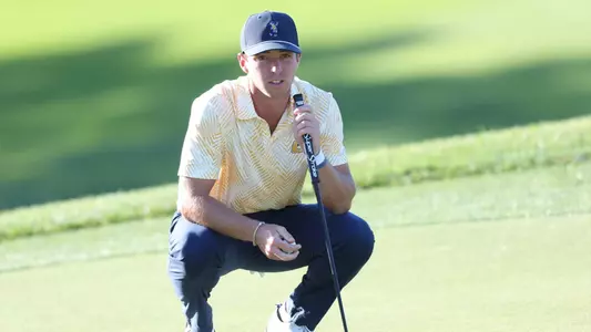 Dalton Chuba reads the green in round one of the Western Intercollegiate