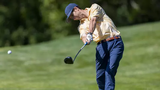 Braedon Wear tees off in the Western Intercollegiate with the ball still in frame just off the driver face