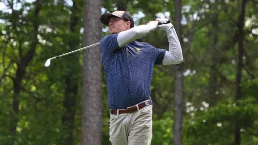 John Houk tracks his ball on the par 3 13th in round 2 of the SoCon Championships