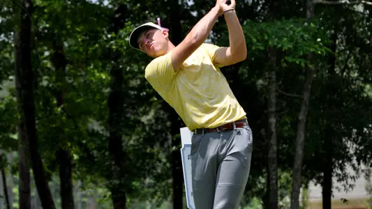 Garrett Engle follows through on his drive at the 2023 NCAA Auburn Regionals