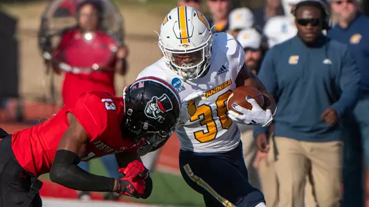 Reggie Davis runs down the UTC sideline bracing for a tackler in the FCS Playoff win at Austin Peay