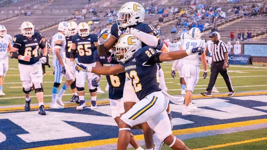 Lance Jackson and friends celebrate his touchdown run in the 2023 win over The Citadel