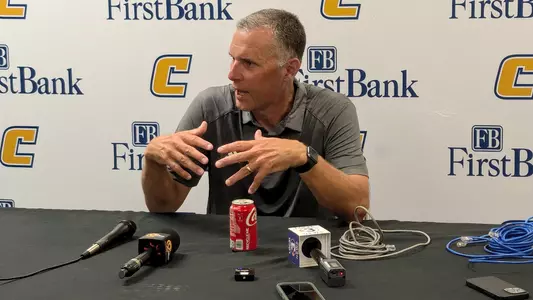 Coach Rusty Wright speaks to the media in his post-game press conference.