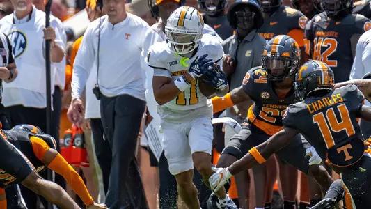Sam Phillips darts along the Tennessee after one of his five catches in Knoxville