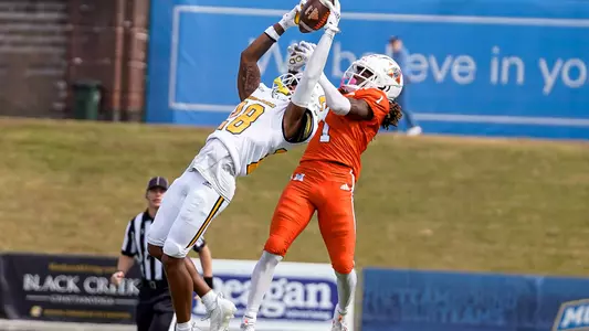 Jordan Walker makes a leaping grab for his 1st interception in the 2022 win over Mercer