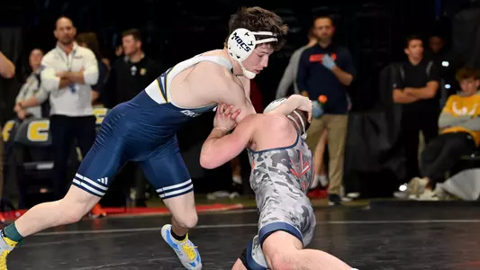 Bryce Luna is in a dominant position looking to complete a takedown against Virginia