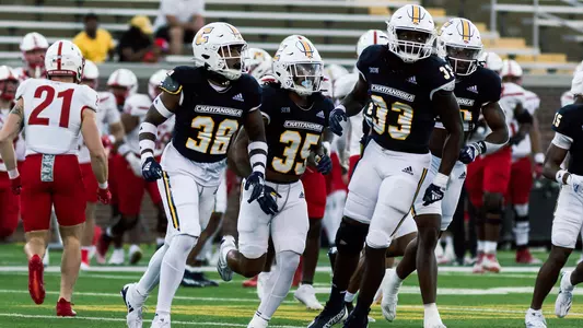 Amanuel Dickson, Martez Cooksey, Jr., & Jestin Gilmore leave the field on a hop after strong kick coverage in the win over VMI.