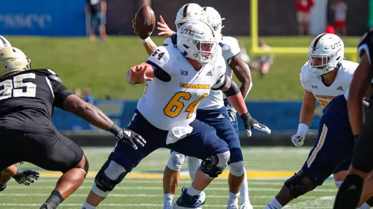 Reid Williams pulls to his left after the snap in the win over Wofford.
