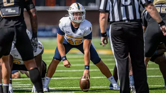 Ethan Myers surveys the potential rush prior to snapping for a field goal attempt against Wofford