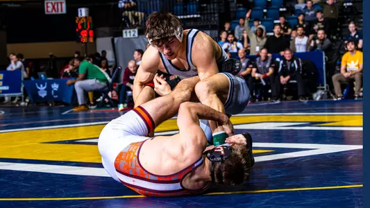 Sergio Desiante looks down in a controlling position over Lennox Wolak in his Southern Scuffle semifinal triumph