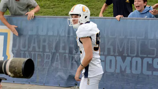 Jude Kelley celebrates high TD run off a fake FG in the win over ETSU