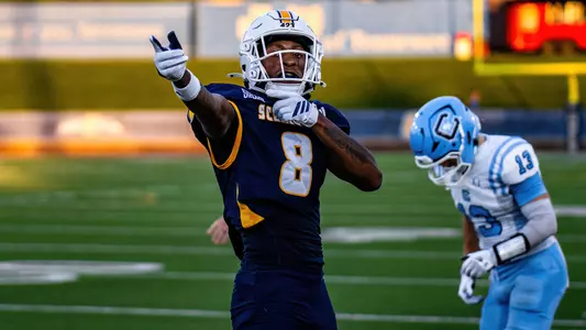 Jamarii Robinson points for the first down chains to move after a catch against The Citadel