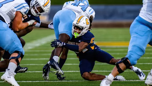 Kamari Todd wraps up a Citadel runner in the 2025 matchup in Finley Stadium