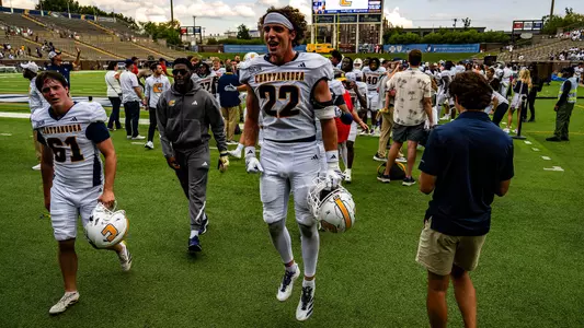 Kaelin Drakeford hops into the locker room with a huge smile after the comeback win over ETSU