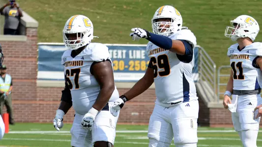 Tyrell Ragland and Aidan Donald eye the Samford defense before setting up for the next play in the 2025 road win
