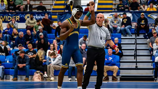 CJ Liddie gets his hand raised after his third win in three matches to open the season